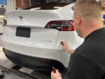 Installing Gyeon Mohs ceramic coating on Tesla Model Y rear bumper