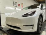 Tesla Model Y front angle with ceramic coating and paint protection film